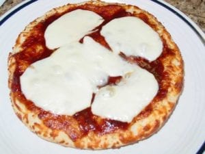 Bake the crust with sauce and cheese before adding barbecue