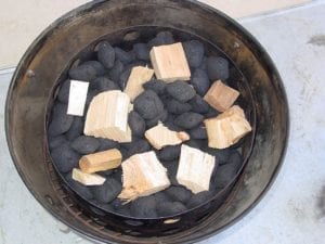 Smoke wood mixed into unlit charcoal
