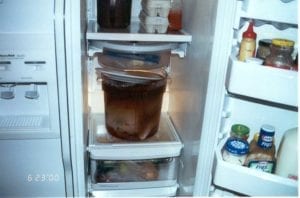 Large round food service container in refrigerator