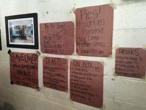 Hand-written signs promote some items on the menu