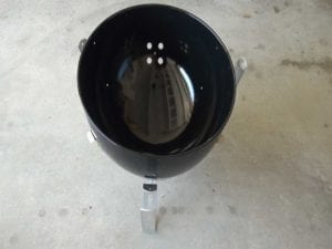Charcoal bowl sitting on top of leg/heat shield assembly